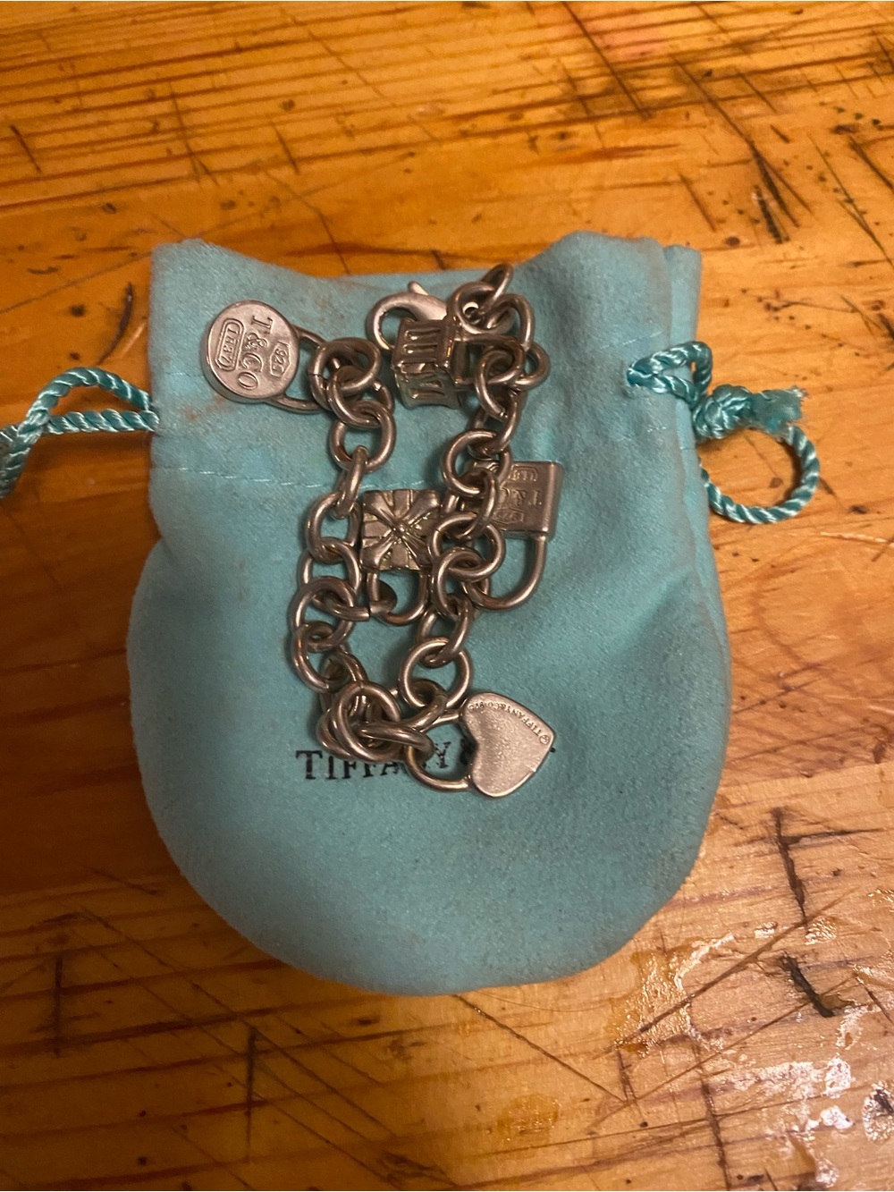 Tiffany & Co. Silver Charm Bracelet with Signature Blue Pouch